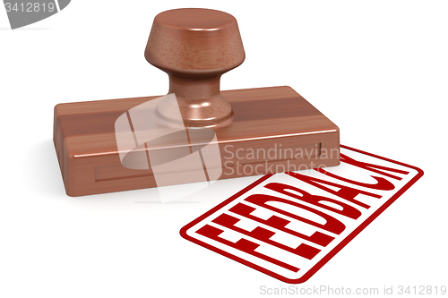 Image of Wooden stamp feedback with red text