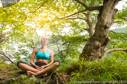 Image of Woman relaxing in beautiful nature.