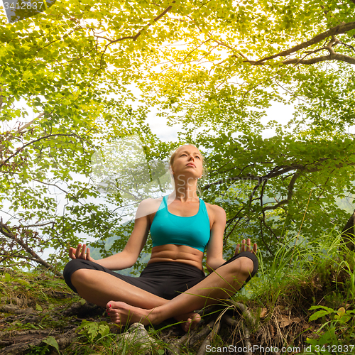 Image of Woman relaxing in beautiful nature.