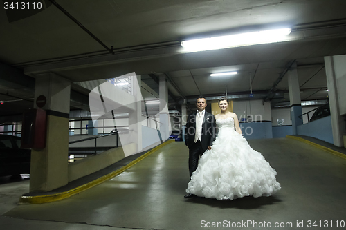 Image of Newlyweds standing in garage