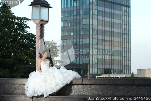Image of Bride posing in city