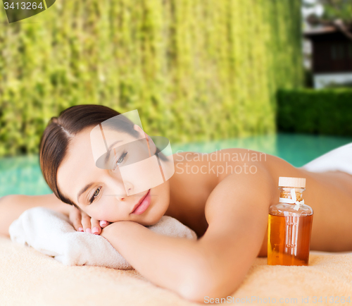 Image of happy woman in beauty spa