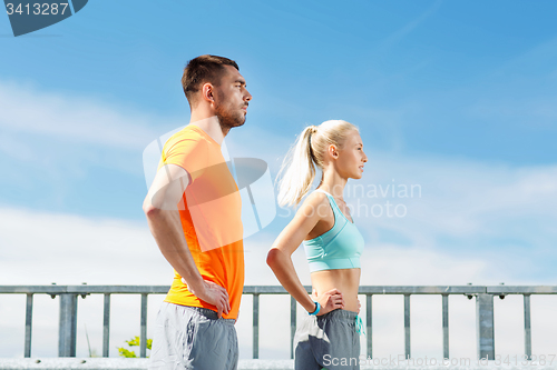 Image of sporty couple outdoors