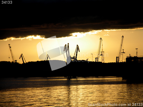 Image of Cranes in sunset