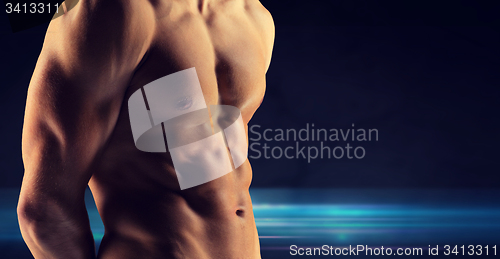 Image of close up of male bodybuilder bare torso