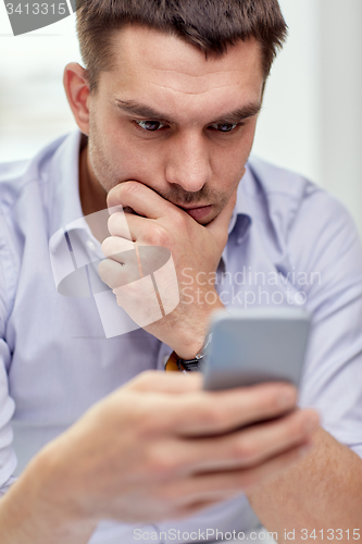 Image of close up of businessman with smartphone