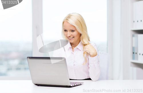 Image of smiling businesswoman or student with laptop