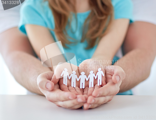 Image of close up of man and girl with cupped hands at home