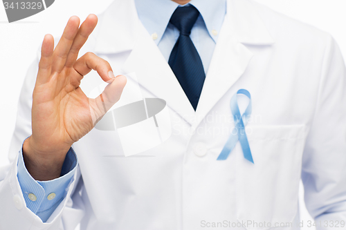 Image of happy doctor with prostate cancer awareness ribbon