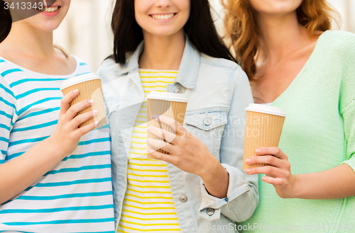 Image of close up of happy young women drinking coffee