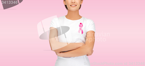 Image of smiling woman with pink cancer awareness ribbon