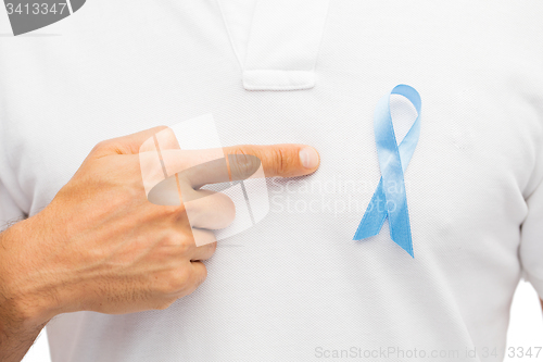 Image of hand with blue prostate cancer awareness ribbon