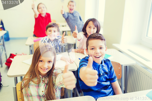 Image of group of school kids showing thumbs up