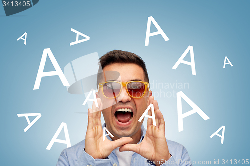 Image of face of angry shouting a letters man in sunglasses