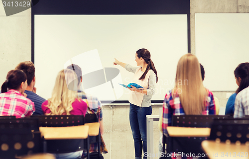 Image of group of smiling students in classroom