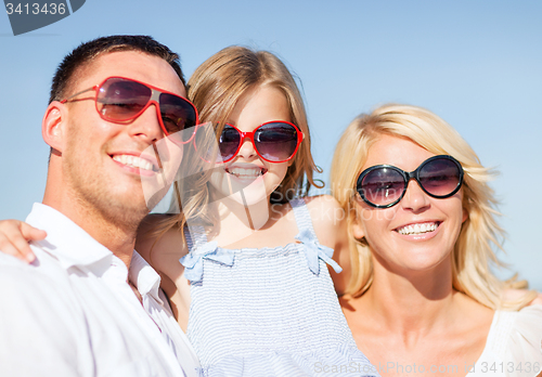 Image of happy family with blue sky