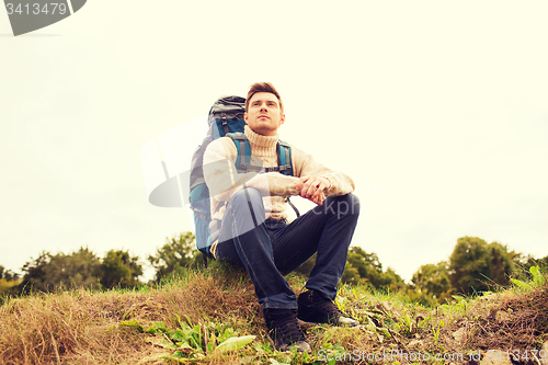 Image of man with backpack hiking