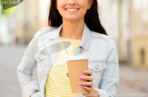 Image of close up of happy young woman drinking coffee