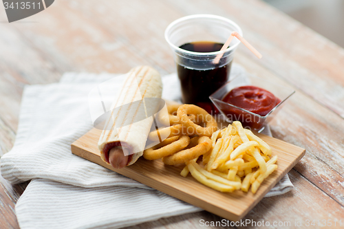 Image of close up of fast food snacks and drink on table