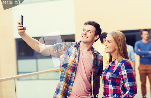 Image of group of smiling students outdoors