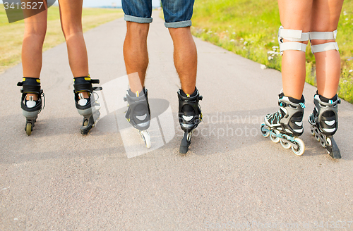 Image of close up of legs in rollerskates skating on road