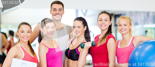 Image of group of smiling people in the gym