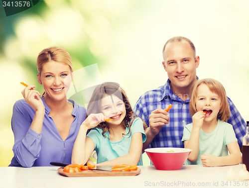 Image of happy family with two kids eating at home