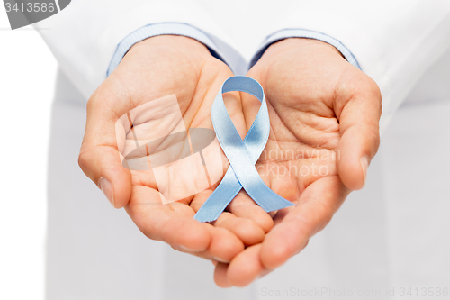 Image of doctor hand with prostate cancer awareness ribbon