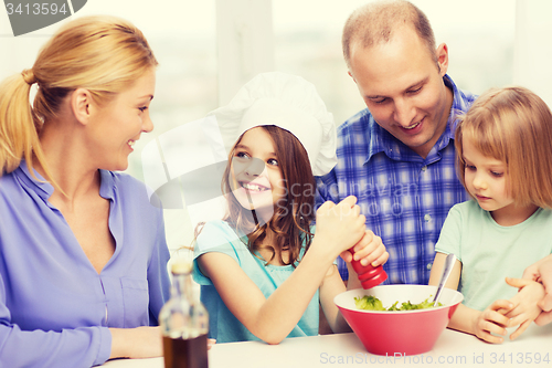 Image of happy family with two kids eating at home