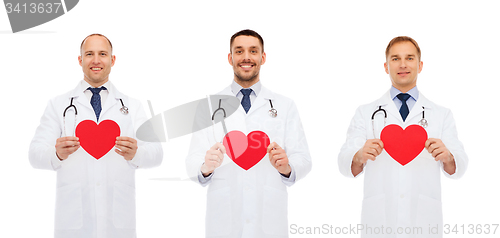 Image of three smiling male doctors with red hearts