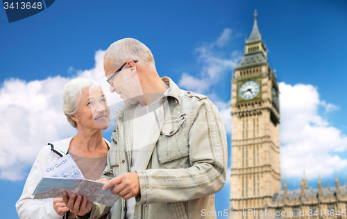 Image of senior couple with map over london big ben tower