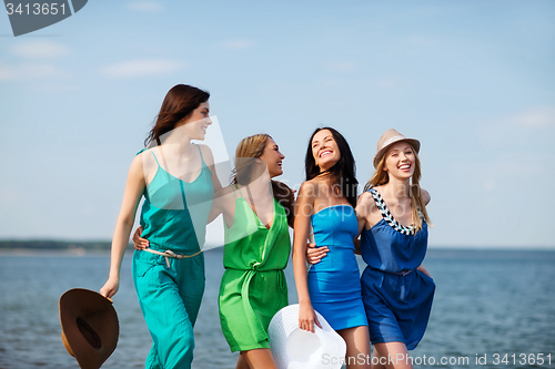 Image of girls walking on the beach