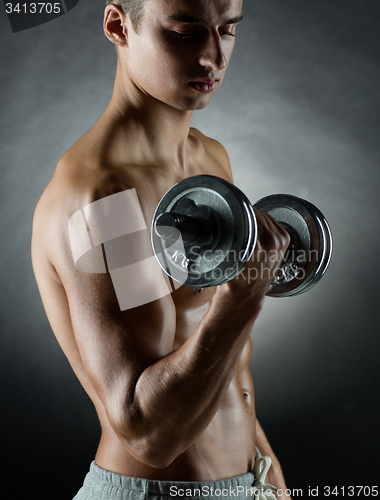 Image of young man with dumbbell