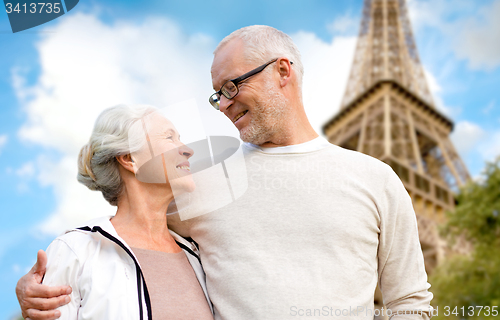 Image of happy senior couple over paris eiffel tower