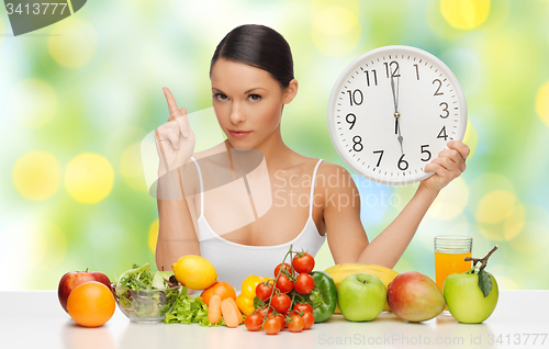 Image of woman with healthy food and clock warning