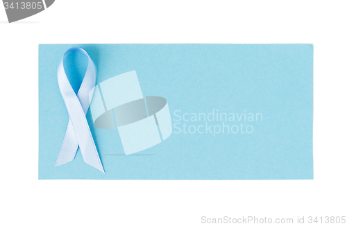 Image of blue prostate cancer awareness ribbon on paper