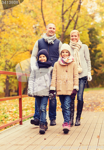 Image of happy family in autumn park