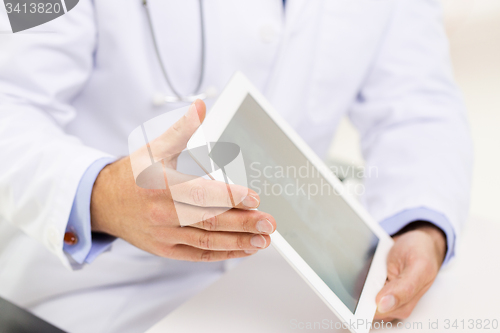 Image of close up of male doctor hands with tablet pc