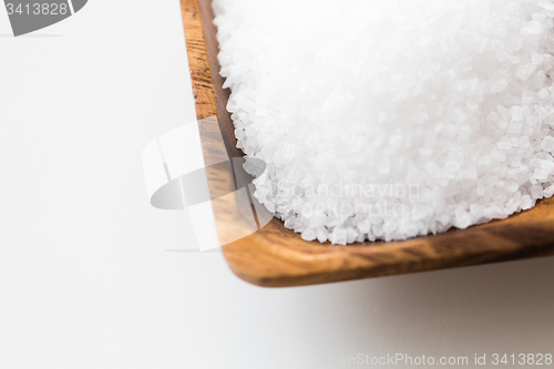 Image of close up of white salt heap in wooden bowl