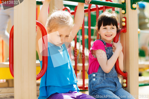 Image of group of happy little girls on children playground