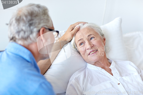 Image of senior couple meeting at hospital ward