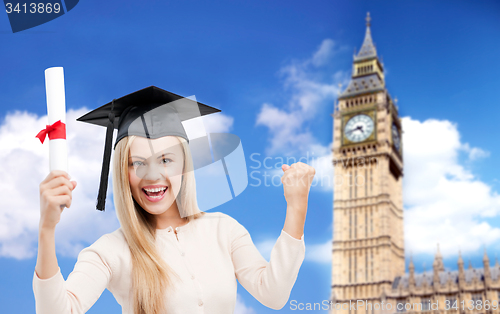 Image of student in trencher cap with diploma over big ben