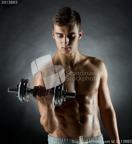 Image of young man with dumbbell