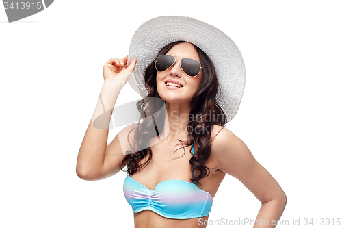 Image of happy young woman in bikini swimsuit and sun hat