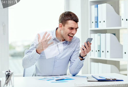 Image of close up of businessman with smartphone