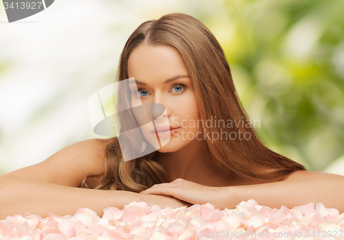 Image of woman with rose petals and long hair