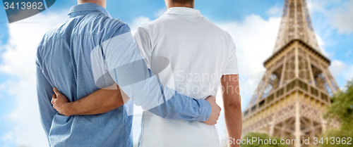 Image of close up of male gay couple over eiffel tower