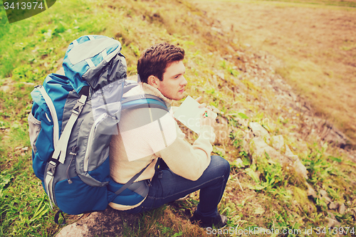 Image of man with backpack hiking