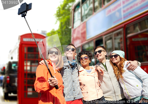 Image of friends taking selfie with smartphone in london