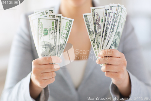 Image of close up of woman hands holding us dollar money